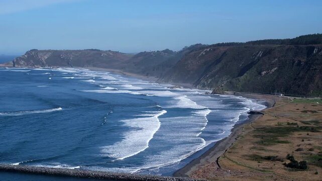Breathtaking panoramic highangle view of the Atlantic coastline from Mirador del Espititu Santo in Asturias, Spain.