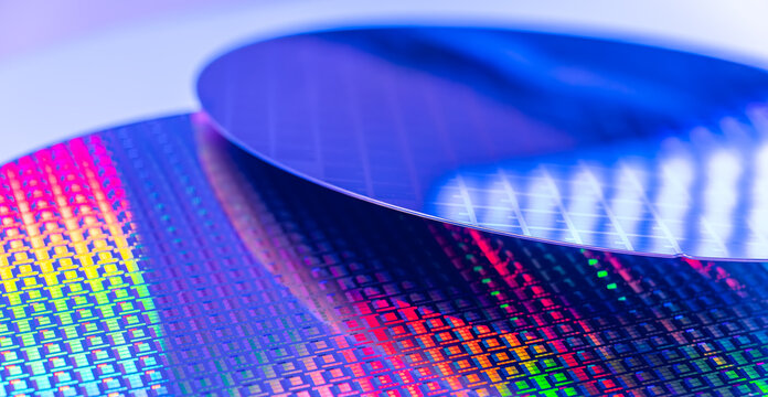 Silicon wafer for manufacturing semiconductor of integrated circuit.Electronic circuit designs have been built onto the wafers using micromaching including photolithography