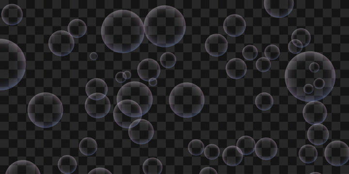 Transparent soap bubbles floating on a dark background
