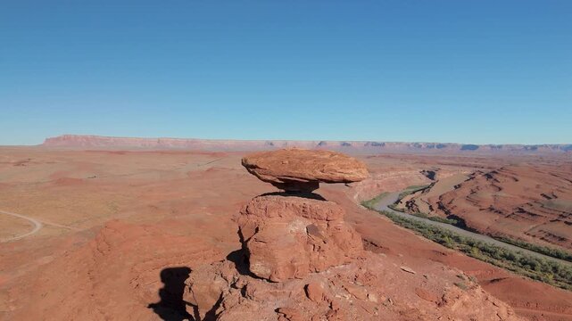 Aerial video of Mexican Hat, a unique balanced rock formation near Mexican Hat, Utah, USA.