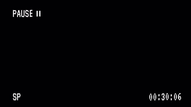 Black screen resembling a paused video recording. Useful for video editing, content creation, and multimedia projects needing a paused screen effect.