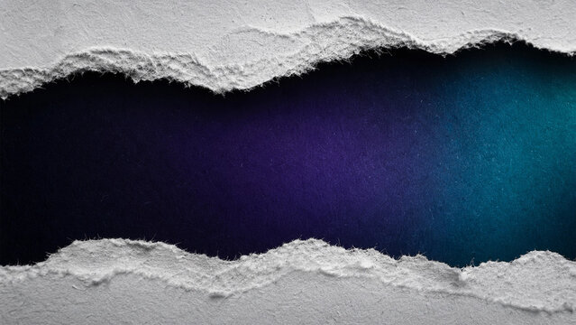 Abstract textured paper torn open revealing a gradient of deep purple and blue hues