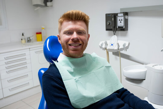 Patient feeling good for regular dental checkup at modern stomatology office