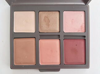 Fototapeta premium A detailed view of a colorful makeup palette with various shades and products