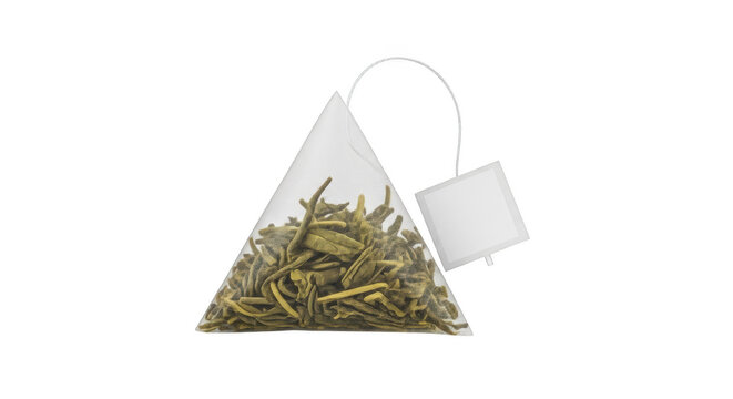 Triangular pyramid tea bag filled with dried green tea leaves and a white paper tag attached, isolated on transparent background