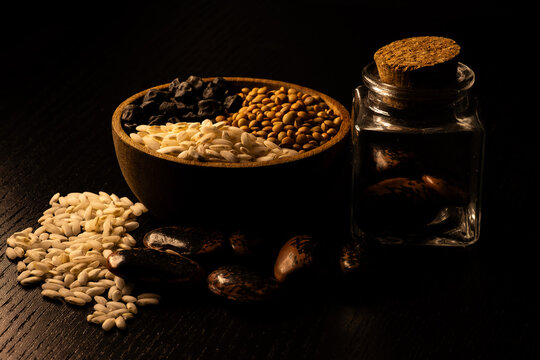 Still life of dried legumes such as lentils, devil's beans and black chickpeas with rice 02.26