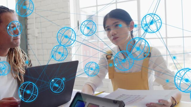 After opening laptop designers reviewing swatch and comps picking hues while blue net linking pages