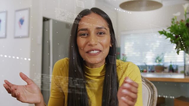 Female presenter starting by speaking to camera in home kitchen, HUD graphics showing tech features