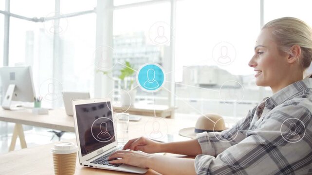 Woman at desk typing on laptop, blue avatar appearing and network icons pulsing, connecting to tech