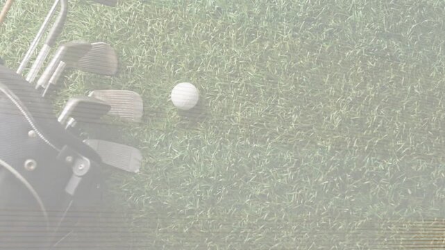 Top-down camera clearing scanline noise and revealing white golf ball and irons for practice demo