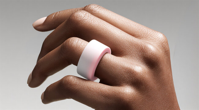 african american woman wearing a smart ring. Innovative wearable technology device for health tracking. Modern digital accessory to monitor wellness. Sleek gadget on finger. Gadget trend