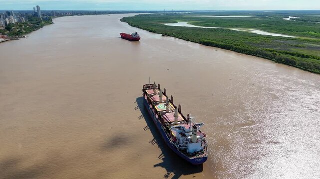 Aerial view of cargo ship navigating parana river near rosario