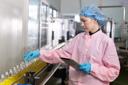 Workers for juice production process at a factory