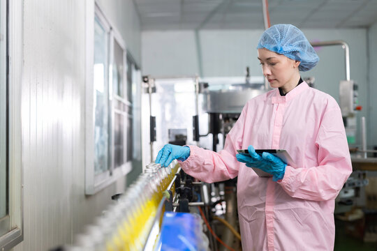 Workers for juice production process at a factory