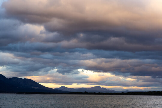 stormy clouds hover over lagoon and san beach, Hermanus, South Africa