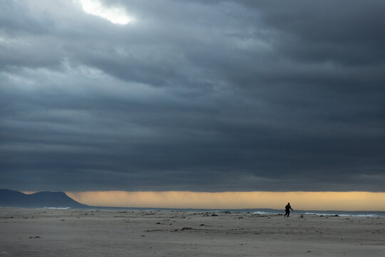 stormy clouds hover over lagoon and san beach, Hermanus, South Africa