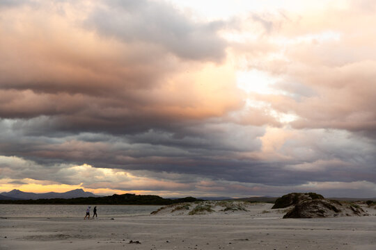 stormy clouds hover over lagoon and san beach, Hermanus, South Africa