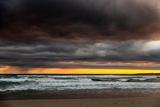 stormy clouds hover over lagoon and san beach, Hermanus, South Africa