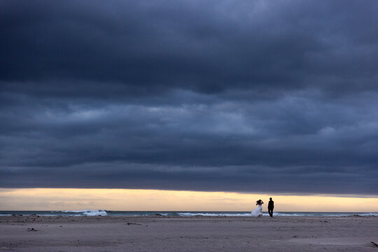 stormy clouds hover over lagoon and san beach, Hermanus, South Africa