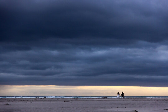 stormy clouds hover over lagoon and san beach, Hermanus, South Africa
