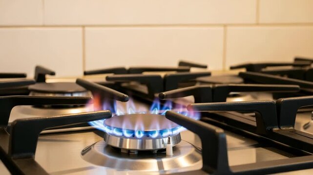 Close-up View Of Stove Burner Ignited Showcasing Blue Flames In Kitchen Setting With Tiled Wall For Cooking Heat Energy Concepts
