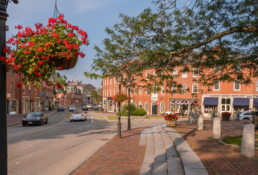 Newburyport, MA, US - September 13, 2022: Street scene in downtown of this small town with its quaint streets with 19th century brick buildings and trendy shops and restaurants.