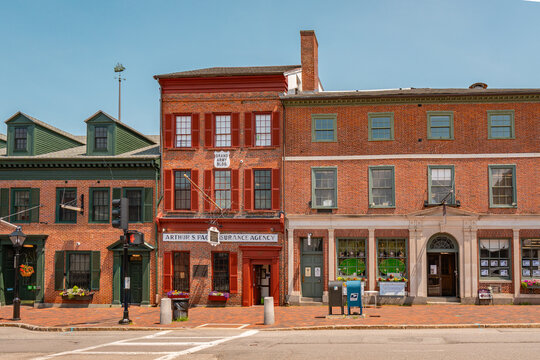 Newburyport, MA, US - September 13, 2022: Street scene in downtown of this small town with its quaint streets with 19th century brick buildings and trendy shops and restaurants.