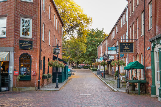 Newburyport, MA, US - September 13, 2022: Street scene in downtown of this small town with its quaint streets with 19th century brick buildings and trendy shops and restaurants.