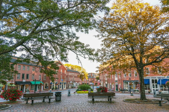 Newburyport, MA, US - September 13, 2022: Street scene in downtown of this small town with its quaint streets with 19th century brick buildings and trendy shops and restaurants.