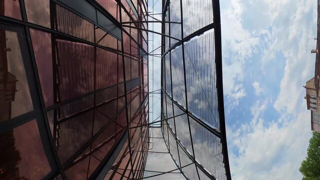 glass and metal atrium roof perspective sky clouds Albi France cathedral modern canopy architecture southern historic city