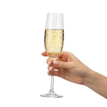 Slender caucasian hand holding a crystal champagne flute filled with golden sparkling juice against a transparent studio background, celebratory toast atmosphere