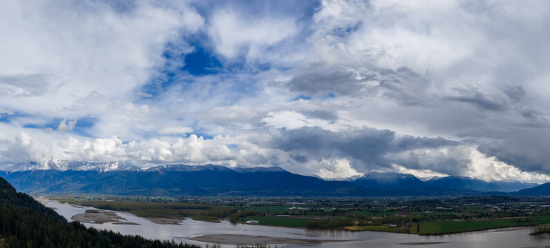 Dramatic Cloudscape Over Fraser Valley Mountains And Fraser River At Harrison Mills, British Columbia, Canada