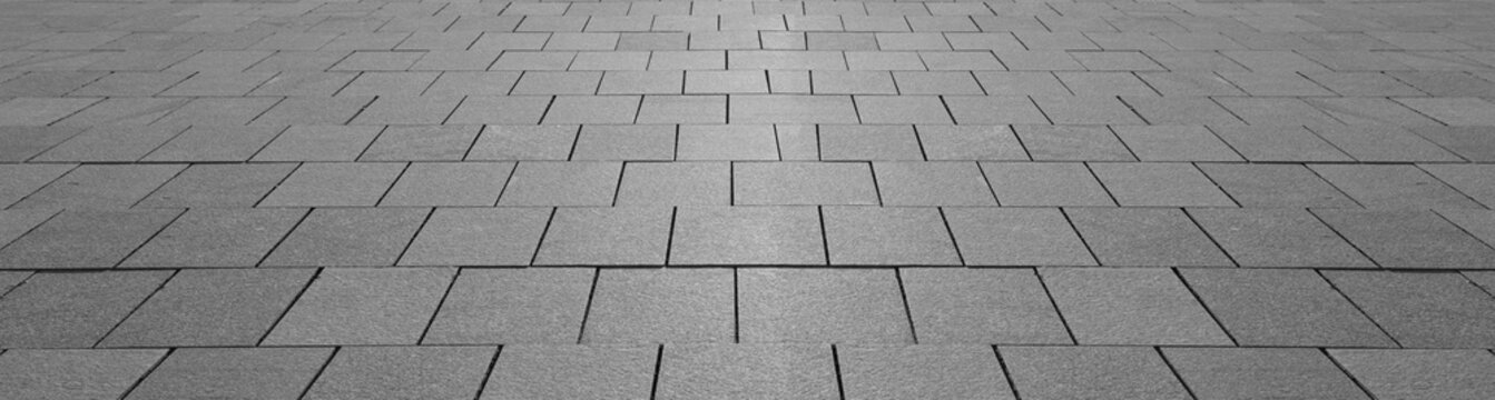 empty stone floor top in perspective. grey tile floor background in perspective view. line. empty copy space stone street. pavement. Granite outdoor tiled floor. gray granite. Marble texture