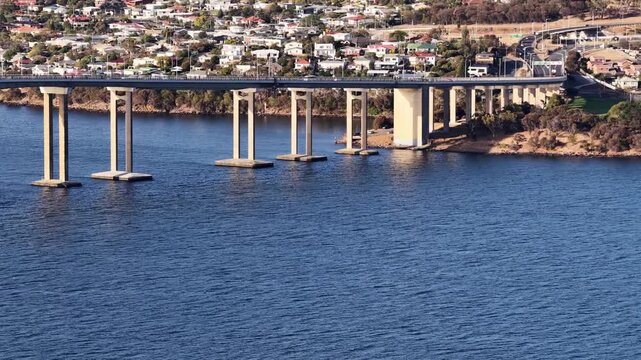Tasman bridge across Derwent river in Hobart city of Tasmania, Australia &ndash; aerial view.