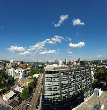 Aerial view of Glenwood South along Hillsborough St with downtown Raleigh NC skyline