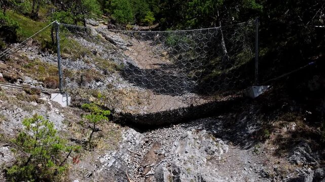 Rockfall protection nets in high mountains 4k video