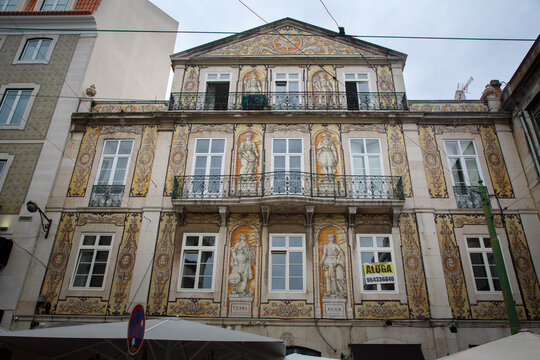 Teatro da Trindade theater and historic buildings with paintings on the facade in Chiado,, Lisbon, Portugal