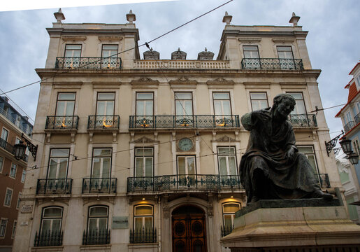 Antonio Ribeiro statue and Palacio Ferreira Pinto Basto historic manor house located on Largo do Chiado in Lisbon