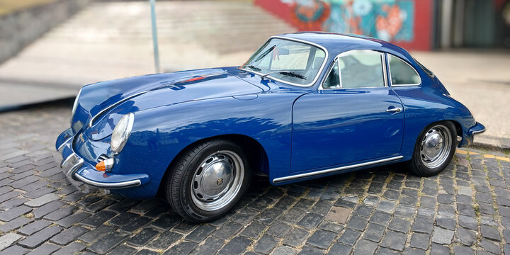 A blue Porsche 356, manufactured between 1948 and 1956, parked on a street in the city of Curitiba, capital of the state of Paran&aacute;, in the southern region of Brazil.