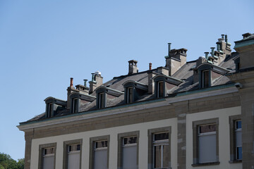 Slate rooftop with dormer windows and chimneys in Lausanne © Joseph Creamer