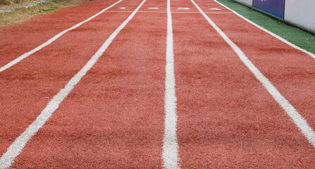 Fototapeta premium Running track lanes at stadium, perspective sports background