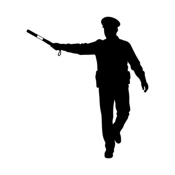 Silhouette of a police officer directing traffic with a baton.
