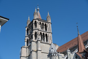 Fototapeta premium Lausanne Cathedral tower against clear blue sky