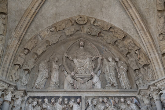 Gothic tympanum sculpture above cathedral door, Lausanne