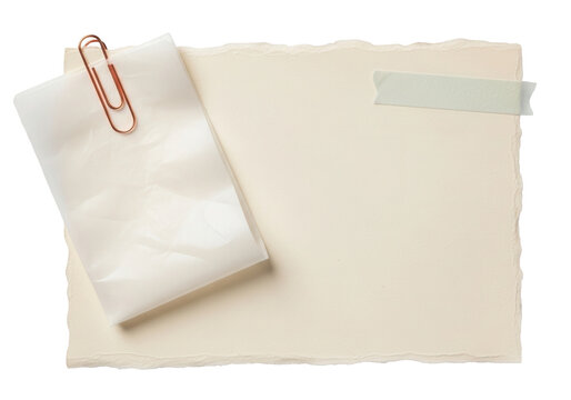 Deckled edge paper with rose gold paperclip folded tracing paper and masking tape on a transparent background