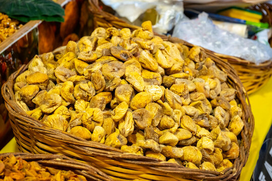 Mix dry fruit sale in the market . Karisik cerez. Vibrant dried fruits and nuts at a market stall. A variety of nuts at a street market in plastic conA lot of almonds in box on sale at farms market, s