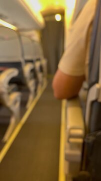 Blurred Vertical Interior of Airplane Aisle and Seats Background