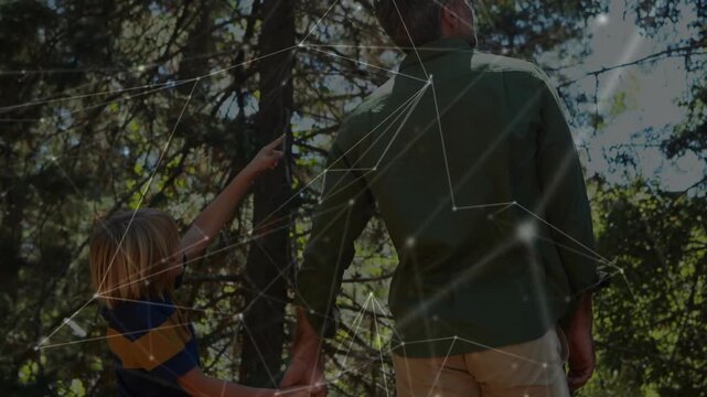 Boy pointing at trees showing interest, man turning and handholding, node overlay crossing for tech