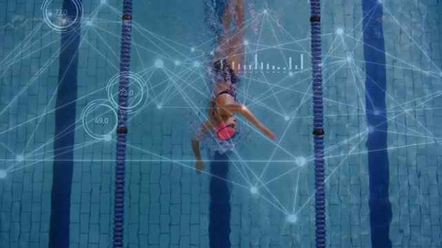 Female swimmer performing freestyle down lane, stroke cycles initiating HUD updating sports metrics
