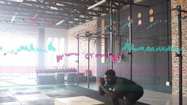 Male athlete launching from squat into explosive box jumps in gym data tracing jumps for training